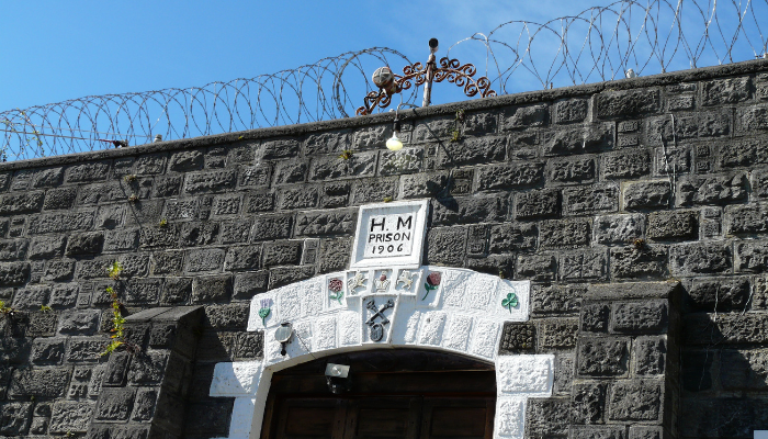 Image: Napier Prison Wall 01 (https://commons.wikimedia.org/wiki/File:Napier_Prison_Wall_01.jpg) by Julie from New Zealand on Wikimedia Commons. CC BY 2.0 (https://creativecommons.org/licenses/by/2.0/deed.en). Image cropped.
