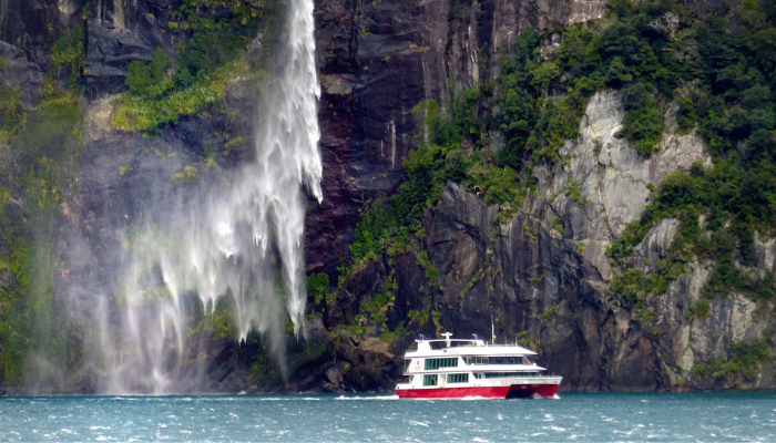 Image: Cruising on Milford Sound. NZ (https://commons.wikimedia.org/wiki/File:Cruising_on_Milford_Sound._NZ._(54986951029).jpg) by Bernard Spragg. NZ on Wikimedia Commons. CC0 1.0 (https://creativecommons.org/publicdomain/zero/1.0/deed.en). Image cropped.

