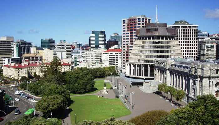 Colour photo overlooking the Aotearoa NZ parliament buildings in Wellington (including Parliament House, the Beehive and Bowen House).