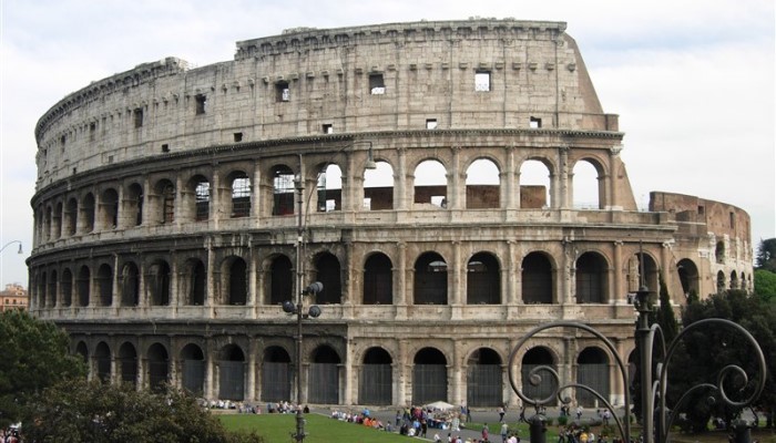 Colour photo of the Colosseum (an ancient amphitheatre in Rome, Italy). It shows the outer wall.