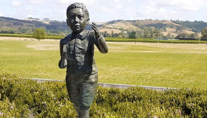Colour photo of a statue of Ernest Rutherford (as a child) at the Rutherford memorial in Brightwater, Aotearoa NZ.