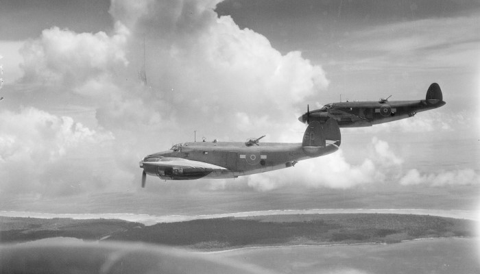 1945 black and white photo from WW2 of 2 No. 4 Squadran Venturas planes flying over Emirau in Papua New Guinea.