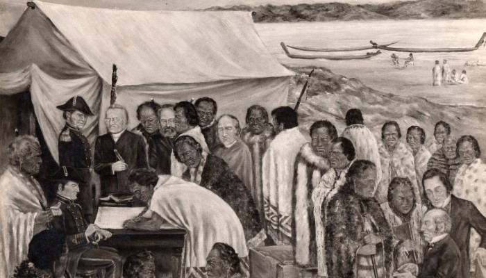 Black and white painting of a Māori rangatira (chief) signing Te Tiriti o Waitangi | The Treaty of Waitangi in front of the Aotearoa NZ Governor. They are joined by a Māori and Pākeha group. A tent is in the background.