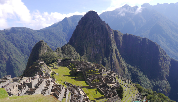 Colour photo of Machu Picchu, a 15th century Incan citadel in Peru. It shows the ruins surrounded by the Andes Mountains.