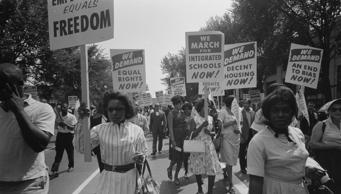 Image: Civil rights march on Washington, D.C. schools (https://commons.wikimedia.org/wiki/File:Civil_rights_march_on_Washington,_D.C._schools.jpg) by Warren K. Leffler on Wikimedia Commons. No known copyright. Image cropped.
