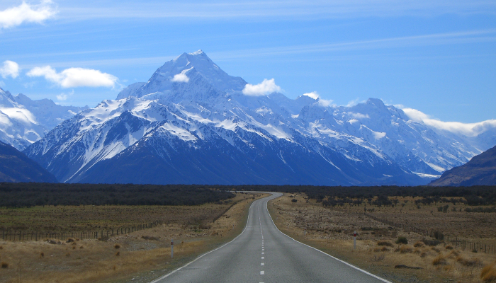 Image: State Highway 80 leading towards Mount Cook in the Southern Alps of New Zealand (https://commons.wikimedia.org/wiki/File:Road_to_mount_cook_new_zealand.jpg) by B Muirhead on Wikimedia Commons.
