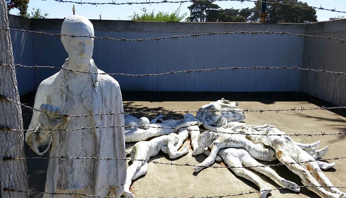 Sculpture at San Francisco's Holocaust Memorial depicts a scene from the Holocaust with statues imprisoned behind barbed wire.