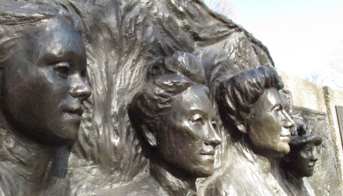 Photo of the Kate Sheppard National Memorial. It shows the faces of Meri Te Tai Mangakahia, Amey Daldy, and Kate Sheppard.