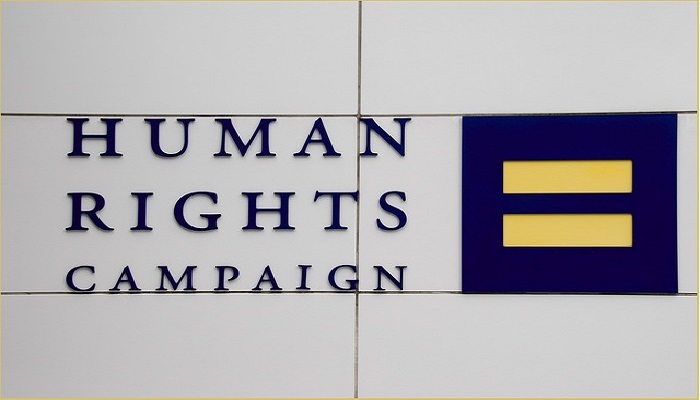 Colour photo of the words 'Human Rights Campaign' beside its logo, the equal sign.