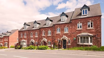 Woman on laptop with MoneySuperMarket logo displayed