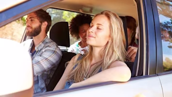 Woman on laptop with MoneySuperMarket logo displayed