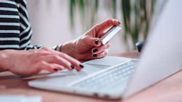 person typing on laptop