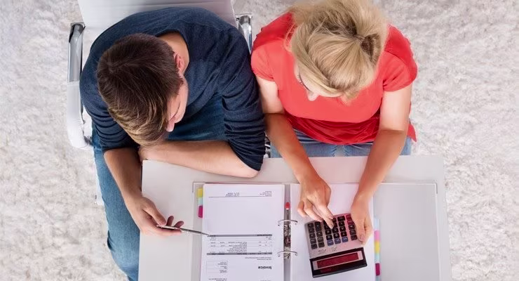Overhead shot of couple working on finances