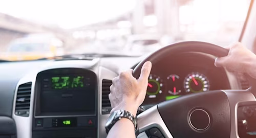 man driving car
