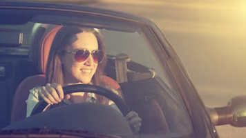 Woman on laptop with MoneySuperMarket logo displayed