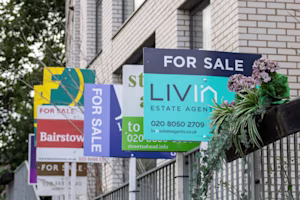 Woman on laptop with MoneySuperMarket logo displayed