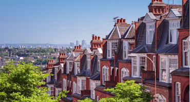 Woman on laptop with MoneySuperMarket logo displayed
