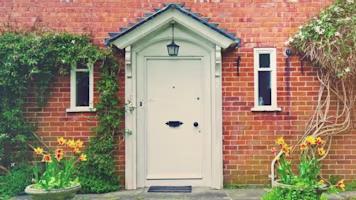 Woman on laptop with MoneySuperMarket logo displayed