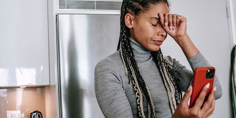 Frustrated woman with phone