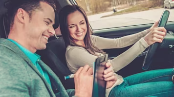 Woman on laptop with MoneySuperMarket logo displayed