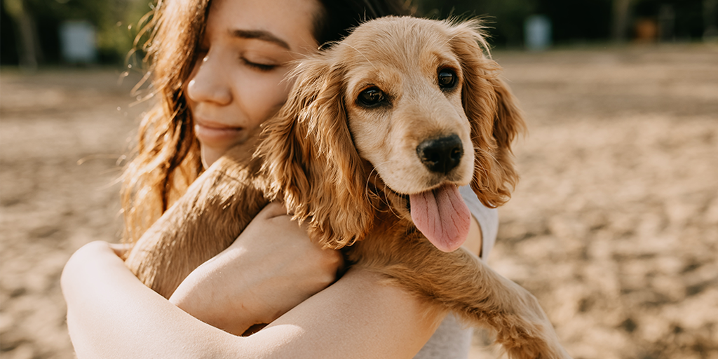 woman hugging dog