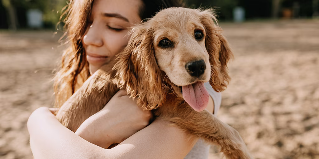 woman hugging dog