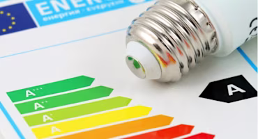 Woman on laptop with MoneySuperMarket logo displayed