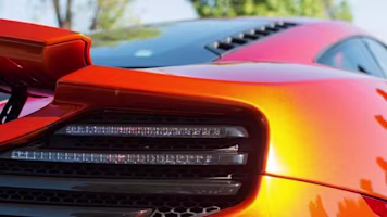 Woman on laptop with MoneySuperMarket logo displayed