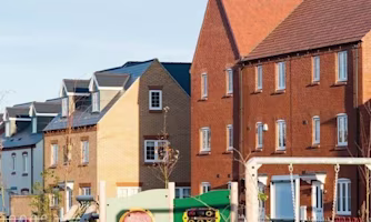 Woman on laptop with MoneySuperMarket logo displayed