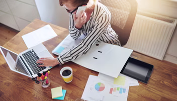 women at computer doing budget