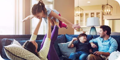 Woman on laptop with MoneySuperMarket logo displayed