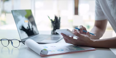 Woman on laptop with MoneySuperMarket logo displayed