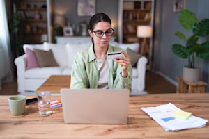 woman holding credit card
