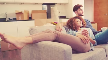 Woman on laptop with MoneySuperMarket logo displayed