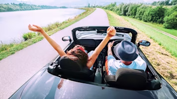Man and woman in car abroad