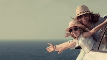 Woman on laptop with MoneySuperMarket logo displayed