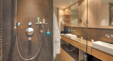 Woman on laptop with MoneySuperMarket logo displayed