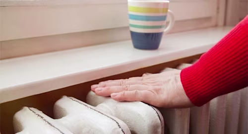 Hand on radiator 