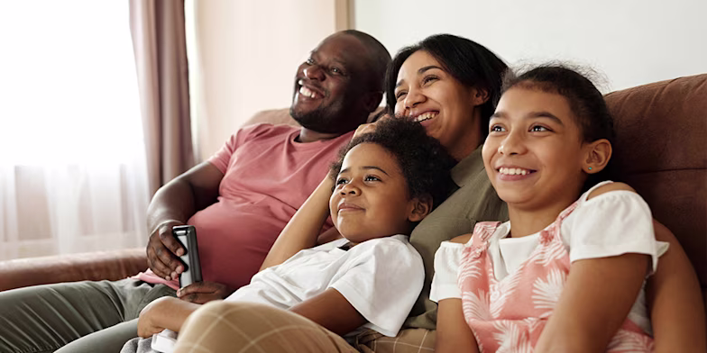 Happy family sitting together