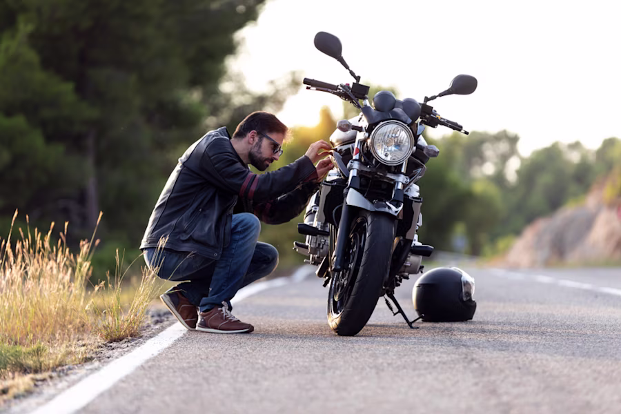 Man fixing a motorcycle