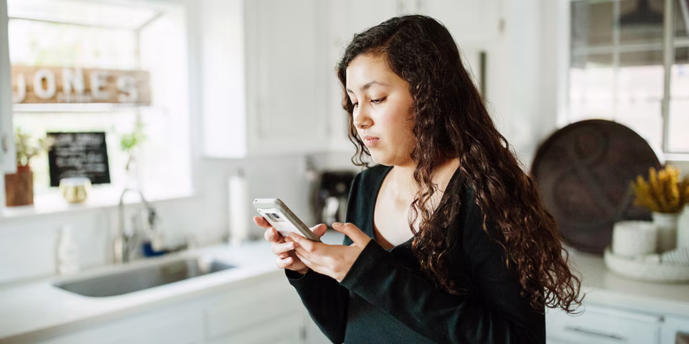young woman looking at phone