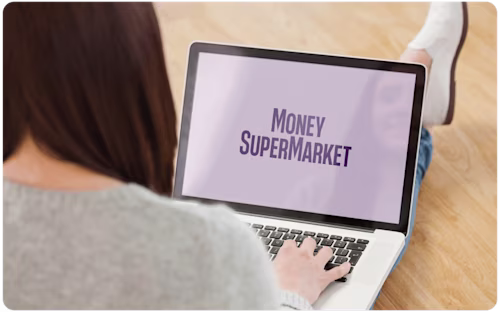 Woman checking MoneySuperMarket website on laptop