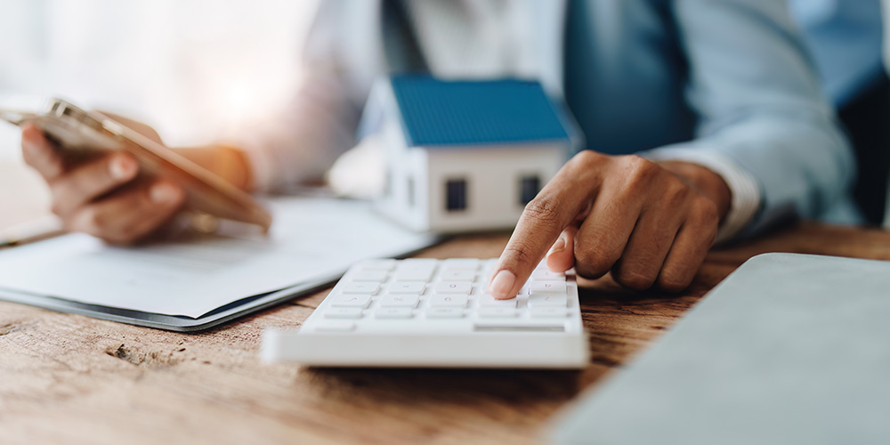 Hand using a calculator