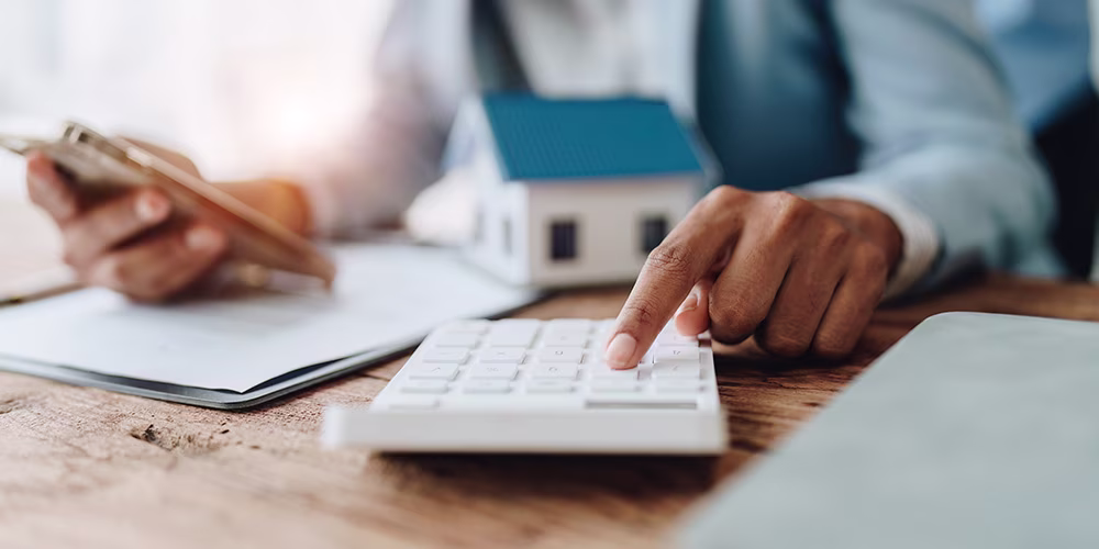Hand using a calculator
