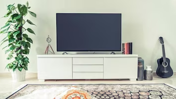 Woman on laptop with MoneySuperMarket logo displayed