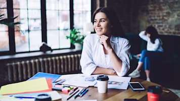 Woman on laptop with MoneySuperMarket logo displayed