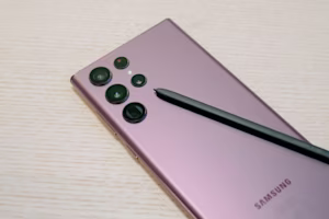 Woman on laptop with MoneySuperMarket logo displayed