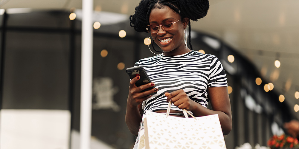 happy woman holding shopping bag