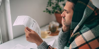 Woman on laptop with MoneySuperMarket logo displayed