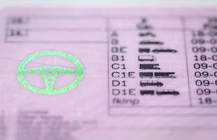 Woman on laptop with MoneySuperMarket logo displayed